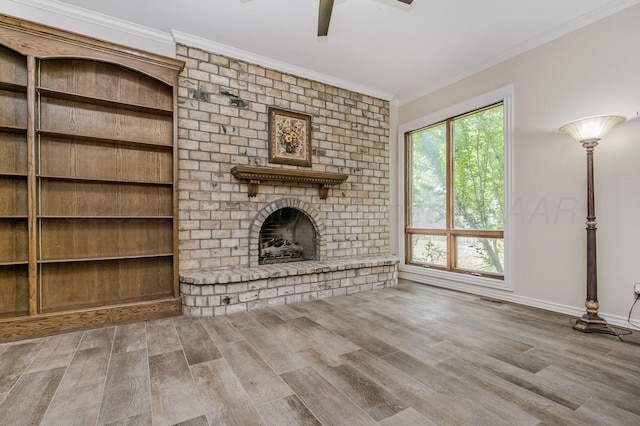 7402 Lynnlee Pl, Amarillo, TX 79121 - unfurnished living room with crown molding, a fireplace, wood finished floors, and a ceiling fan