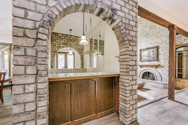 7402 Lynnlee Pl, Amarillo, TX 79121 - bathroom with wood finished floors, crown molding, and a fireplace