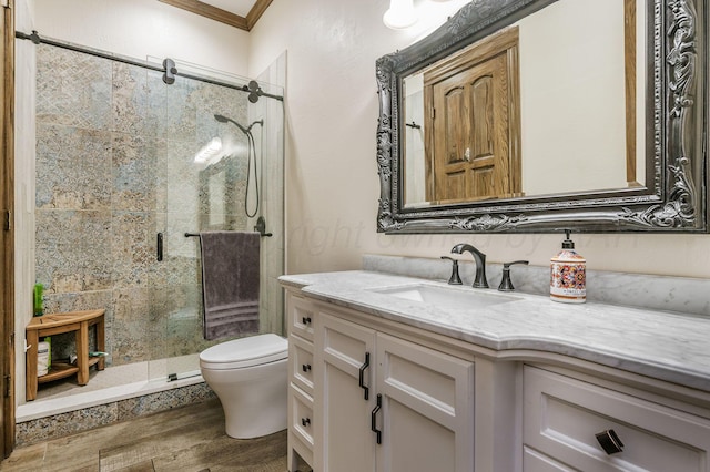 7402 Lynnlee Pl, Amarillo, TX 79121 - bathroom with a shower stall, vanity, wood finished floors, and ornamental molding