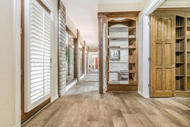 7402 Lynnlee Pl, Amarillo, TX 79121 - hallway with wood finished floors and healthy amount of natural light