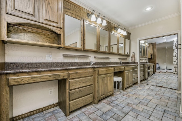 7402 Lynnlee Pl, Amarillo, TX 79121 - bathroom featuring stone tile floors, vanity, and ornamental molding