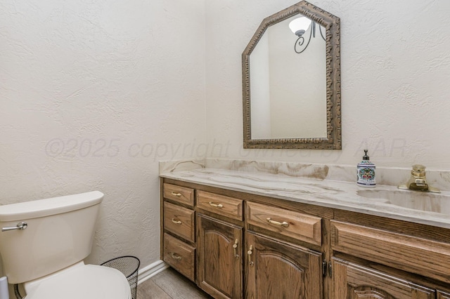 7402 Lynnlee Pl, Amarillo, TX 79121 - half bathroom with vanity and a textured wall
