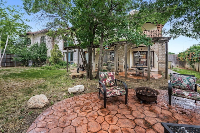 7402 Lynnlee Pl, Amarillo, TX 79121 - back of house with a patio, brick siding, an outdoor fire pit, and a fenced backyard