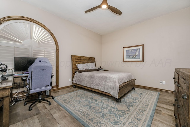 7402 Lynnlee Pl, Amarillo, TX 79121 - bedroom with wood finished floors, a desk, and a ceiling fan