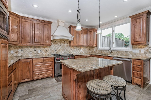 7402 Lynnlee Pl, Amarillo, TX 79121 - kitchen with appliances with stainless steel finishes, premium range hood, light stone countertops, a breakfast bar area, and recessed lighting