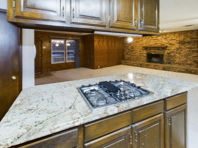 1924 N Dwight St, Pampa, TX 79065 - kitchen with light stone countertops and stainless steel gas stovetop