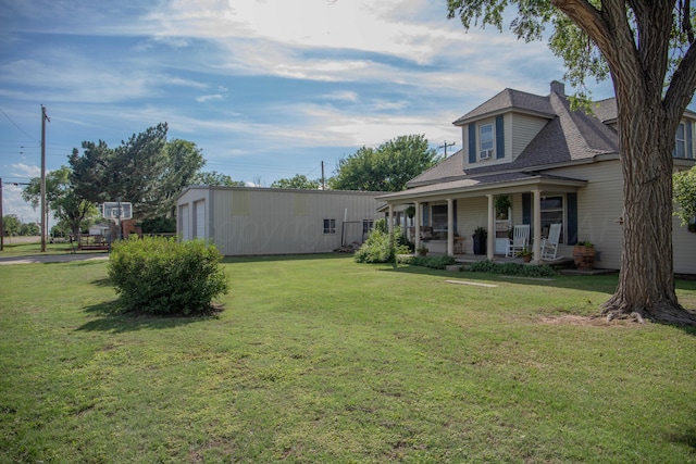 400 W 7th St, Panhandle, TX 79068 - view of grassy yard featuring a porch and a garage