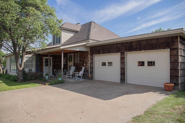 400 W 7th St, Panhandle, TX 79068 - view of front facade with concrete driveway, a garage, roof with shingles, a porch, and cooling unit