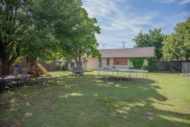 400 W 7th St, Panhandle, TX 79068 - fenced backyard with a trampoline and a playground