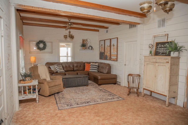 400 W 7th St, Panhandle, TX 79068 - living room with beamed ceiling, a chandelier, and wood walls