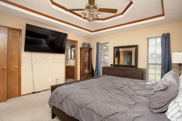8001 Arbor St, Amarillo, TX 79110 - bedroom with a raised ceiling, light colored carpet, a textured ceiling, ceiling fan, and ensuite bath