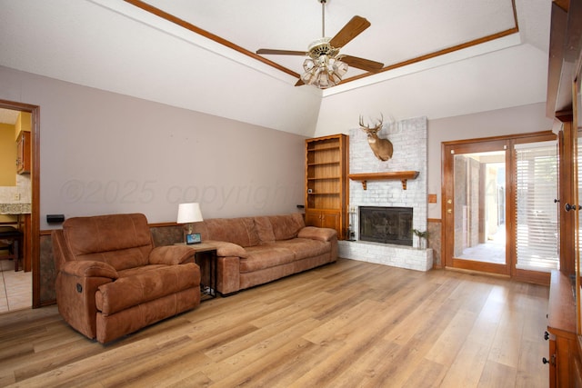 8001 Arbor St, Amarillo, TX 79110 - living area with a brick fireplace, ceiling fan, light wood-style floors, and vaulted ceiling