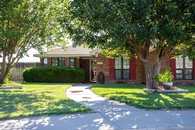8001 Arbor St, Amarillo, TX 79110 - obstructed view of property featuring brick siding