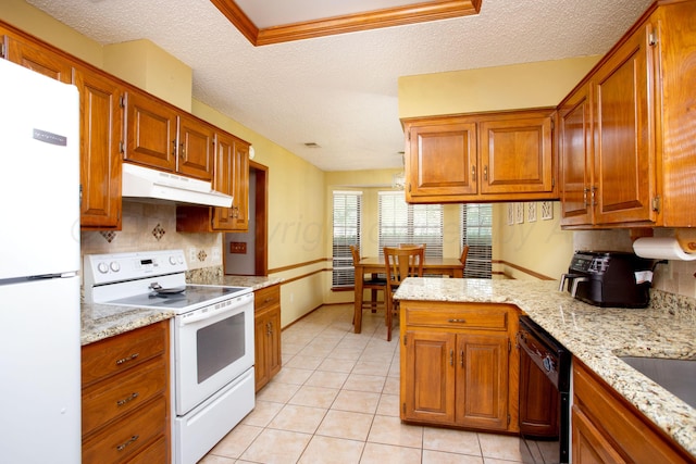8001 Arbor St, Amarillo, TX 79110 - kitchen featuring white appliances, under cabinet range hood, a textured ceiling, light tile patterned floors, and brown cabinetry