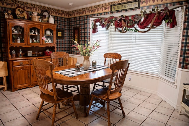 tiled dining room with crown molding