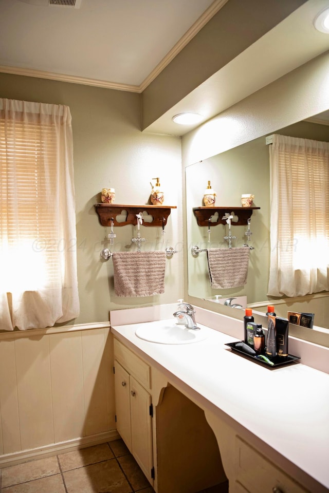 bathroom with tile patterned flooring, vanity, and ornamental molding