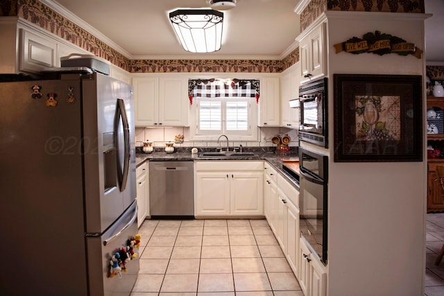 kitchen with black appliances, light tile patterned flooring, ornamental molding, white cabinetry, and sink