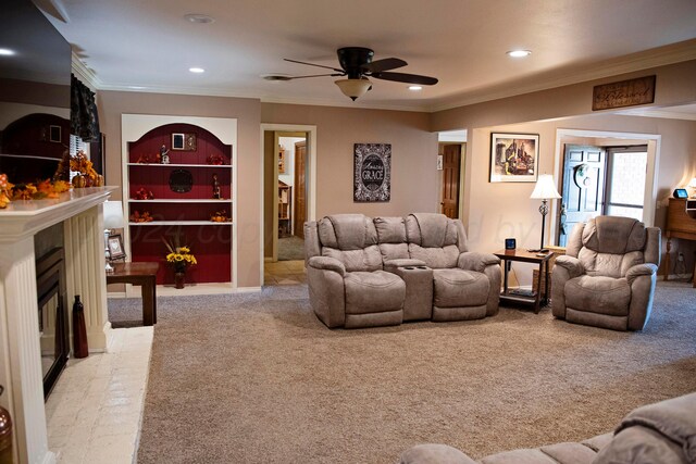 living room featuring crown molding, light carpet, and ceiling fan