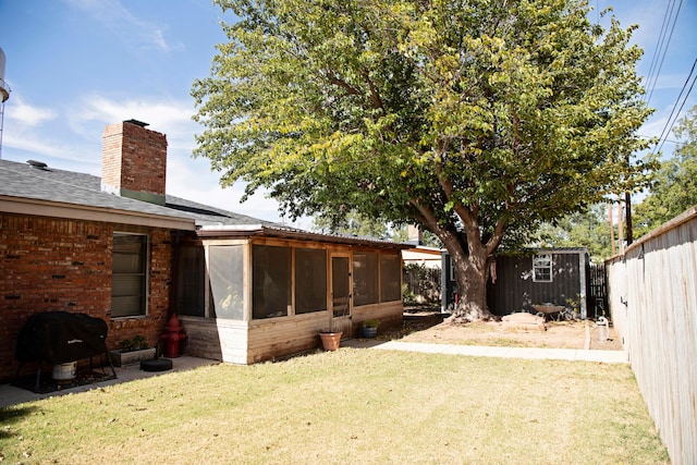 view of yard with a sunroom