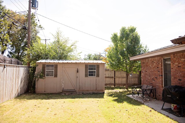 view of outbuilding featuring a yard