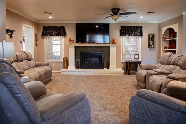 living room featuring ornamental molding, carpet, and ceiling fan