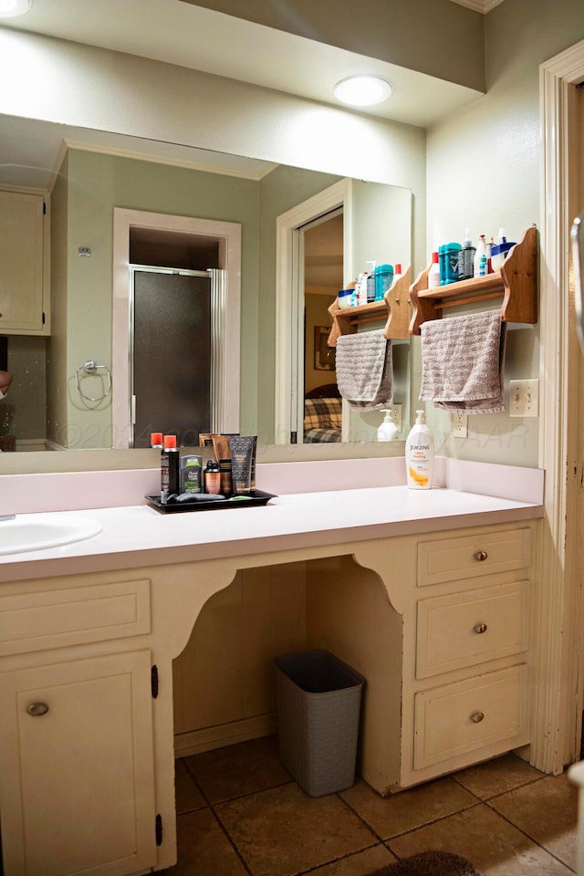 bathroom with vanity and tile patterned flooring