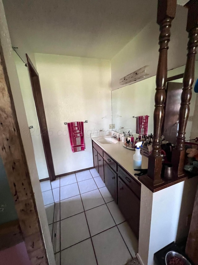 514 Willow Ln, Hereford, TX 79045 - bathroom featuring double vanity and tile patterned floors