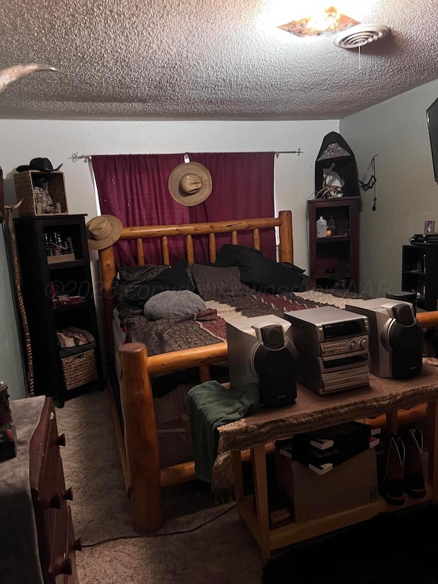 514 Willow Ln, Hereford, TX 79045 - carpeted bedroom with a textured ceiling