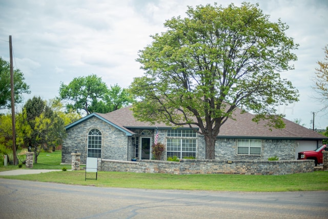 200 Tanglewood Dr, Amarillo, TX 79118 - ranch-style home with a front lawn, roof with shingles, and stone siding