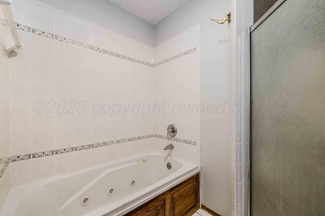 full bathroom featuring a shower with shower door and a jetted tub