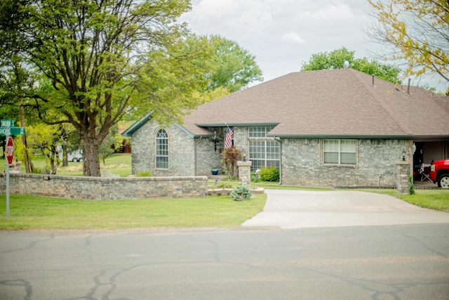 200 Tanglewood Dr, Amarillo, TX 79118 - view of front of home featuring roof with shingles, brick siding, and a front yard