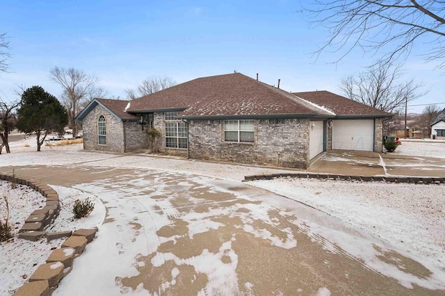 200 Tanglewood Dr, Amarillo, TX 79118 - view of front of house featuring driveway, brick siding, a garage, and roof with shingles