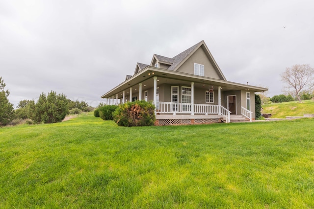 view of front of property with a porch and a front lawn