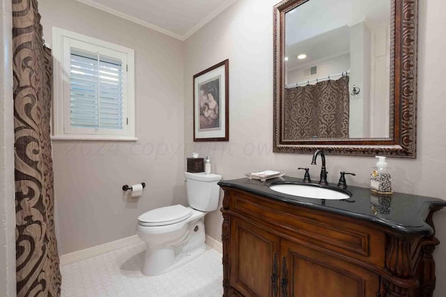 2200 Parker St, Amarillo, TX 79109 - full bathroom with vanity, toilet, baseboards, ornamental molding, and tile patterned flooring