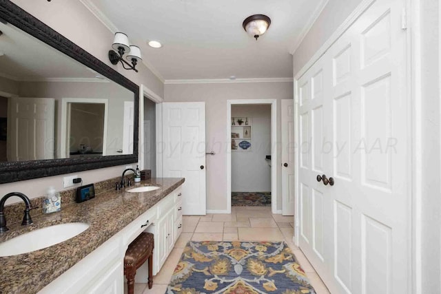 2200 Parker St, Amarillo, TX 79109 - bathroom with double vanity, baseboards, crown molding, and tile patterned floors