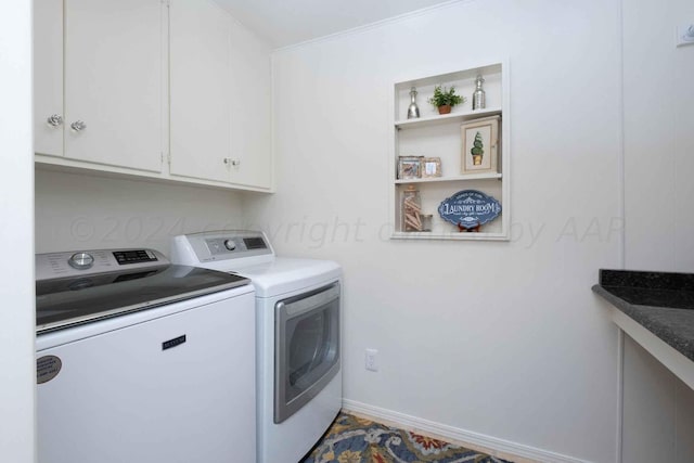 2200 Parker St, Amarillo, TX 79109 - washroom featuring cabinet space, washer and dryer, and baseboards