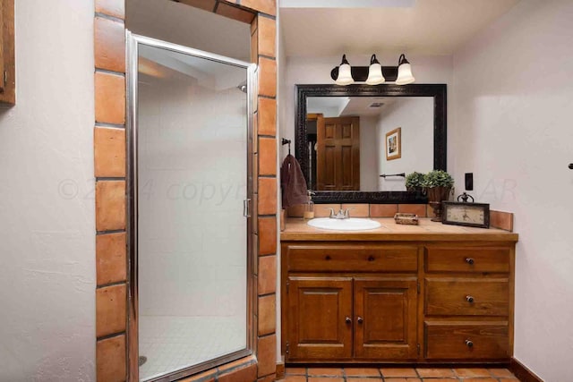 2200 Parker St, Amarillo, TX 79109 - full bathroom featuring vanity, a stall shower, and tile patterned floors