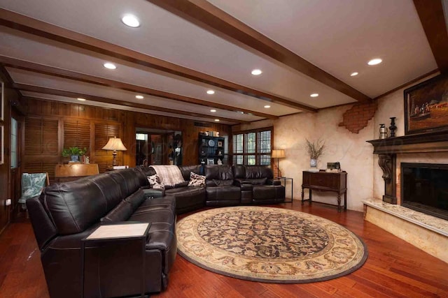 2200 Parker St, Amarillo, TX 79109 - living room with beamed ceiling, wood finished floors, a fireplace, recessed lighting, and wooden walls