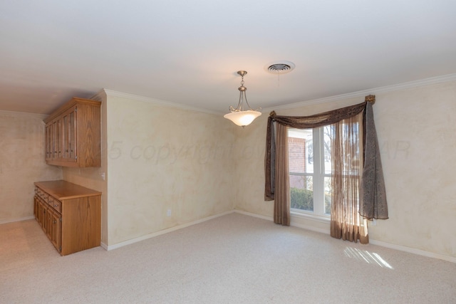 interior space with ornamental molding and light colored carpet