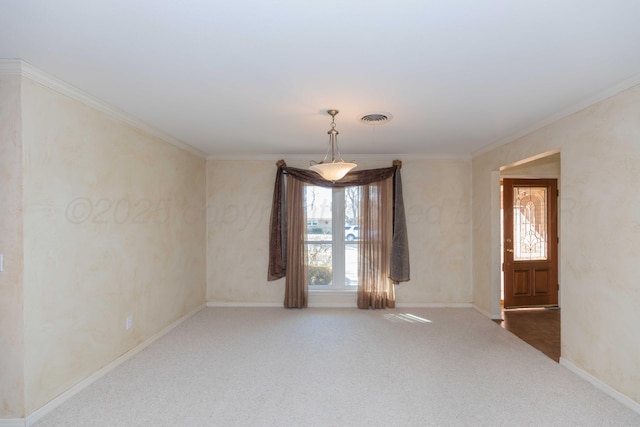 carpeted empty room with crown molding