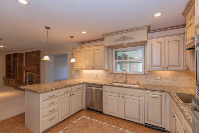 kitchen featuring decorative light fixtures, dishwasher, sink, backsplash, and kitchen peninsula