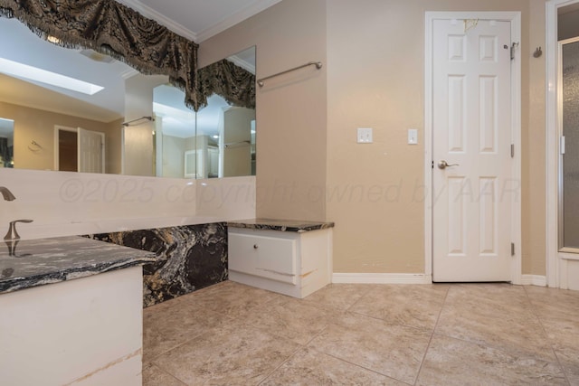 bathroom featuring vanity, ornamental molding, and tile patterned floors