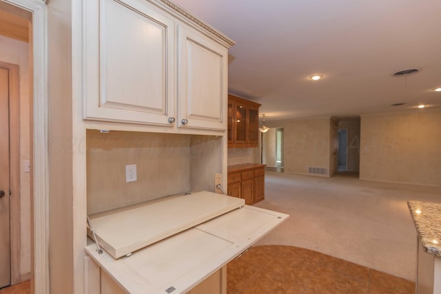 kitchen featuring light colored carpet