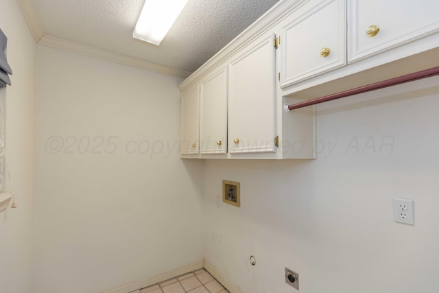 clothes washing area featuring cabinets, ornamental molding, a textured ceiling, and electric dryer hookup