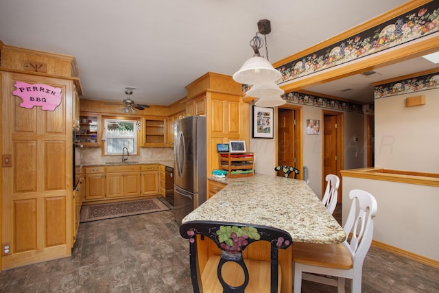2900 Teckla Blvd, Amarillo, TX 79106 - kitchen with open shelves, freestanding refrigerator, a breakfast bar area, dark wood-style flooring, and a peninsula