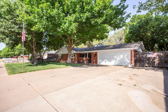 2900 Teckla Blvd, Amarillo, TX 79106 - view of front of property featuring concrete driveway, a garage, and brick siding