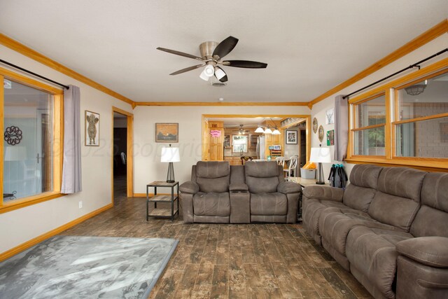 2900 Teckla Blvd, Amarillo, TX 79106 - living area with ceiling fan, dark wood-style floors, ornamental molding, and a chandelier