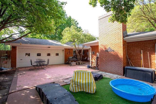 2900 Teckla Blvd, Amarillo, TX 79106 - view of patio with concrete driveway and a garage