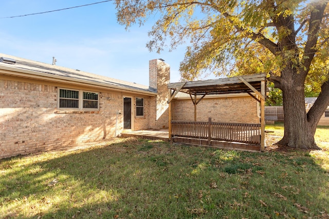 back of house featuring a yard