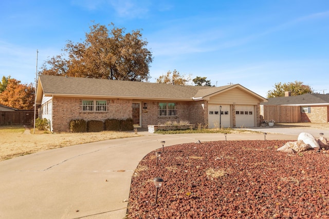 ranch-style home featuring a garage